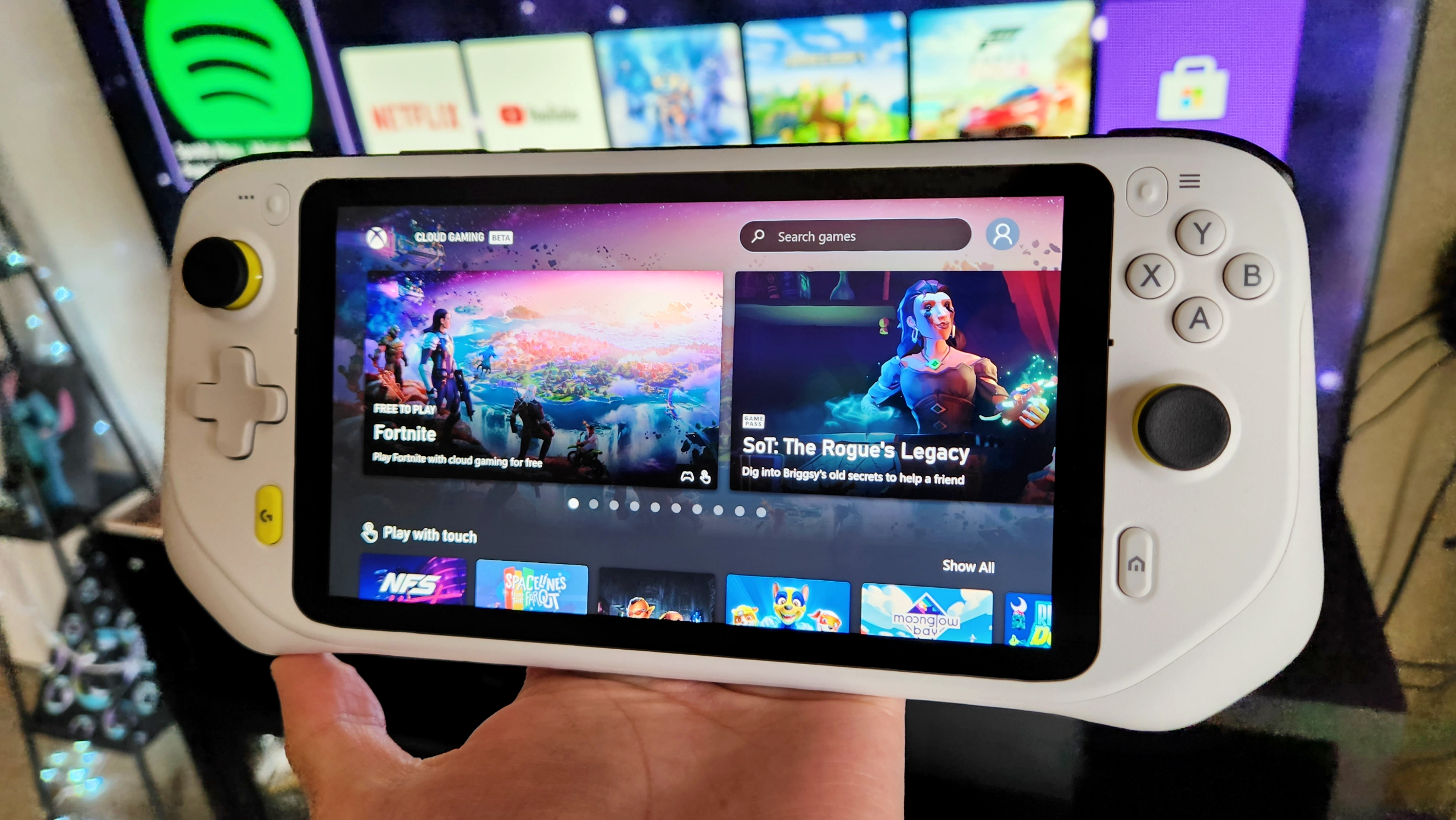 Logitech G Cloud held in hand with Xbox Cloud Gaming.