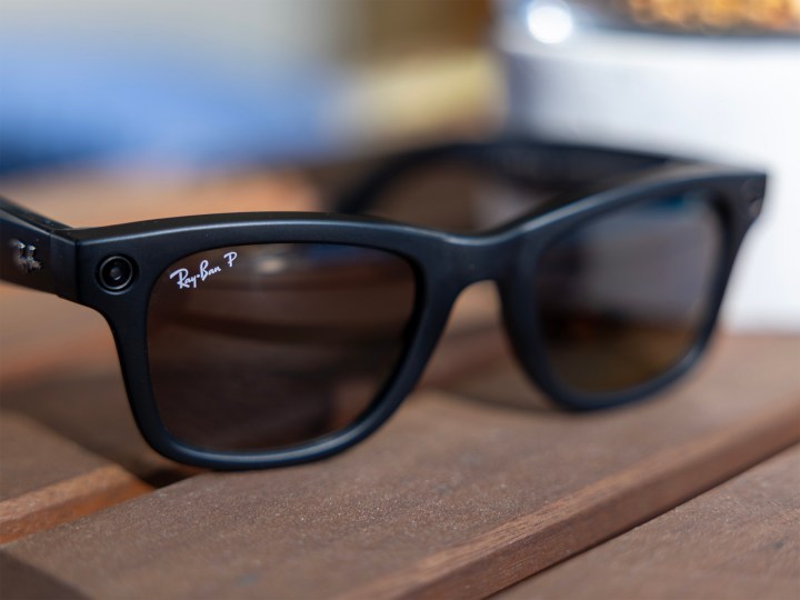 A pair of Ray-Ban Meta smart glasses on a table.