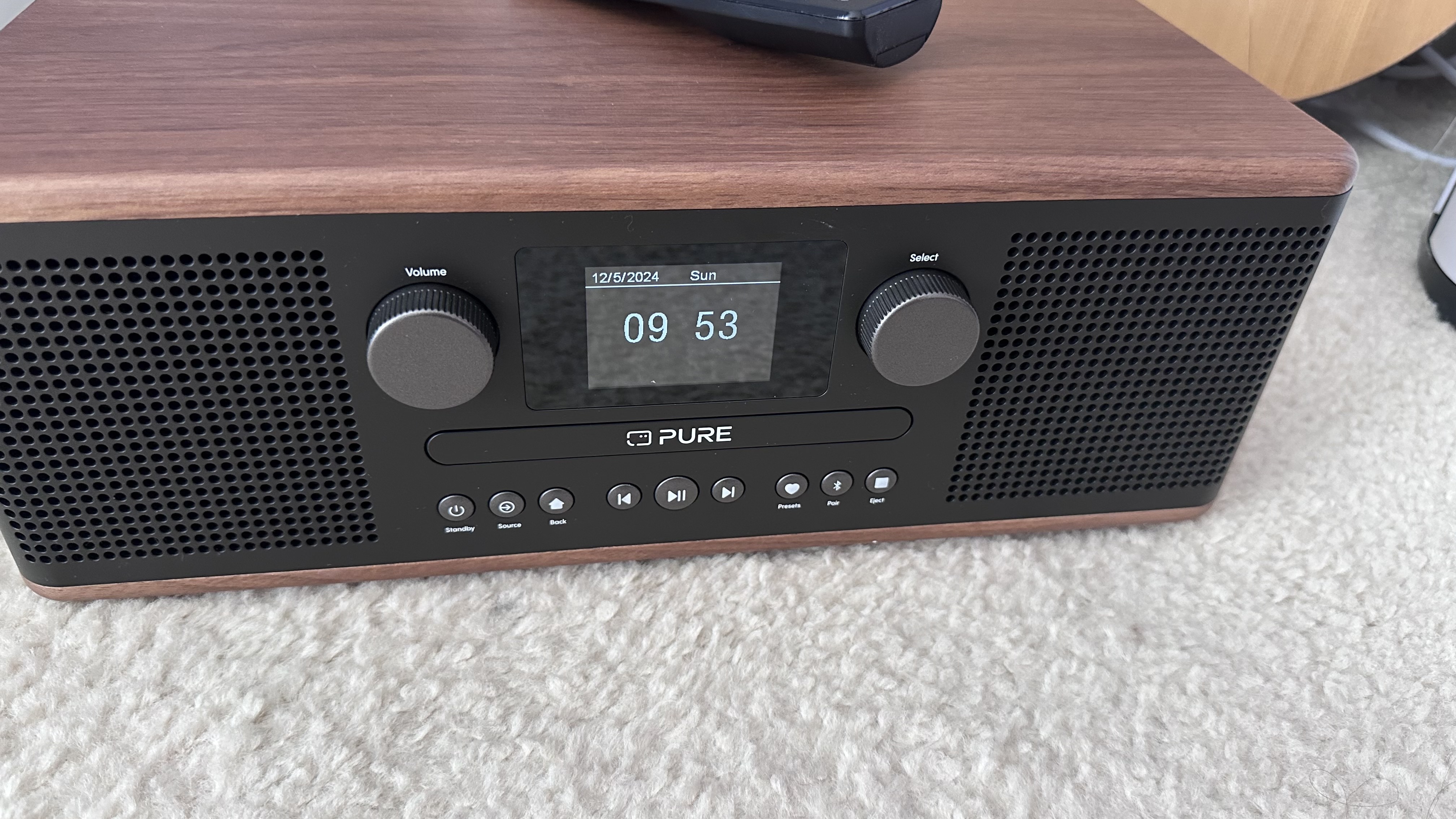 Pure Classic C-D6 DAB/FM Radio, CD player, Bluetooth speaker with a remote control on a carpet