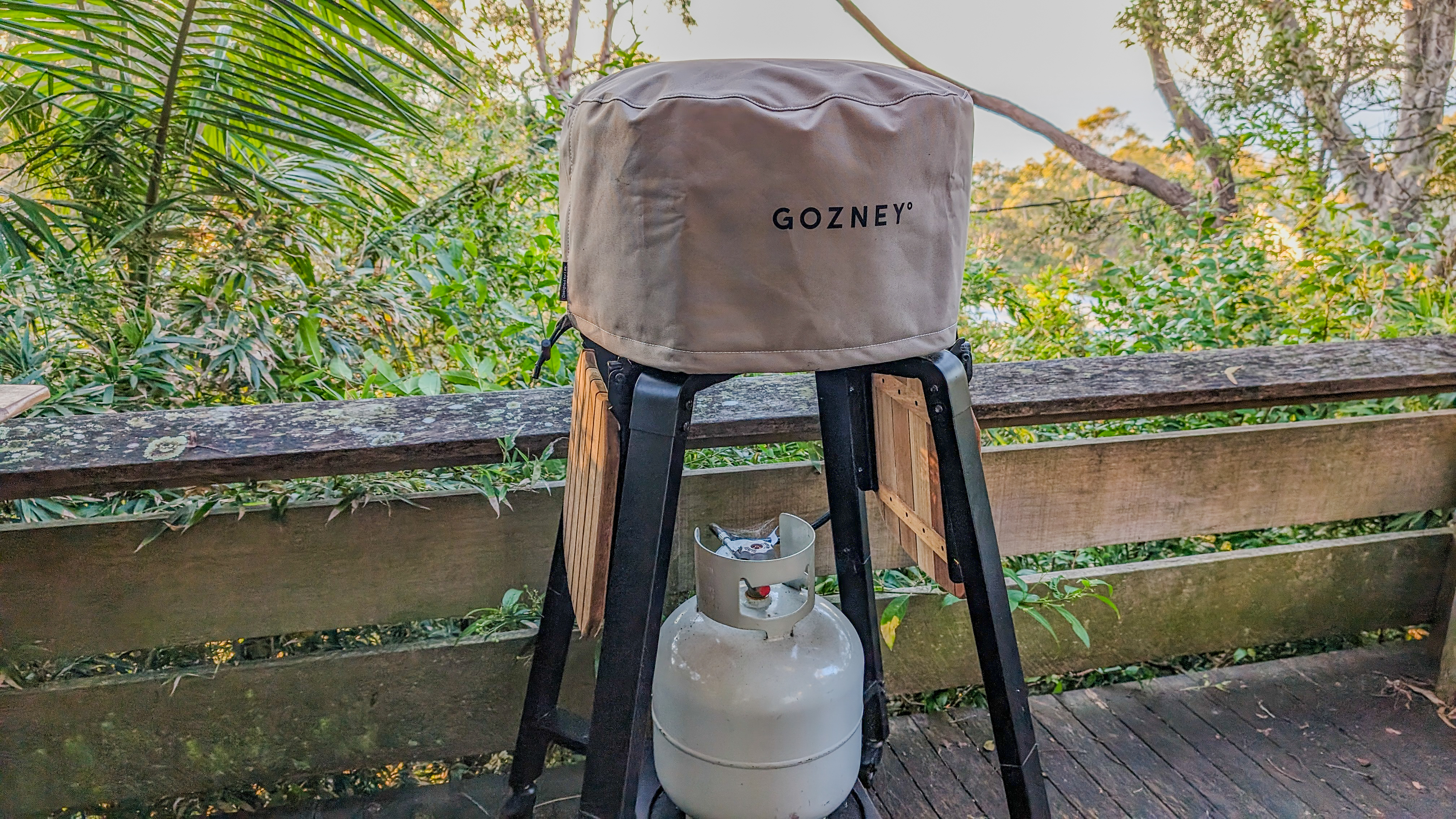 Gozney Arc XL pizza oven on its stand and covered with a branded cover