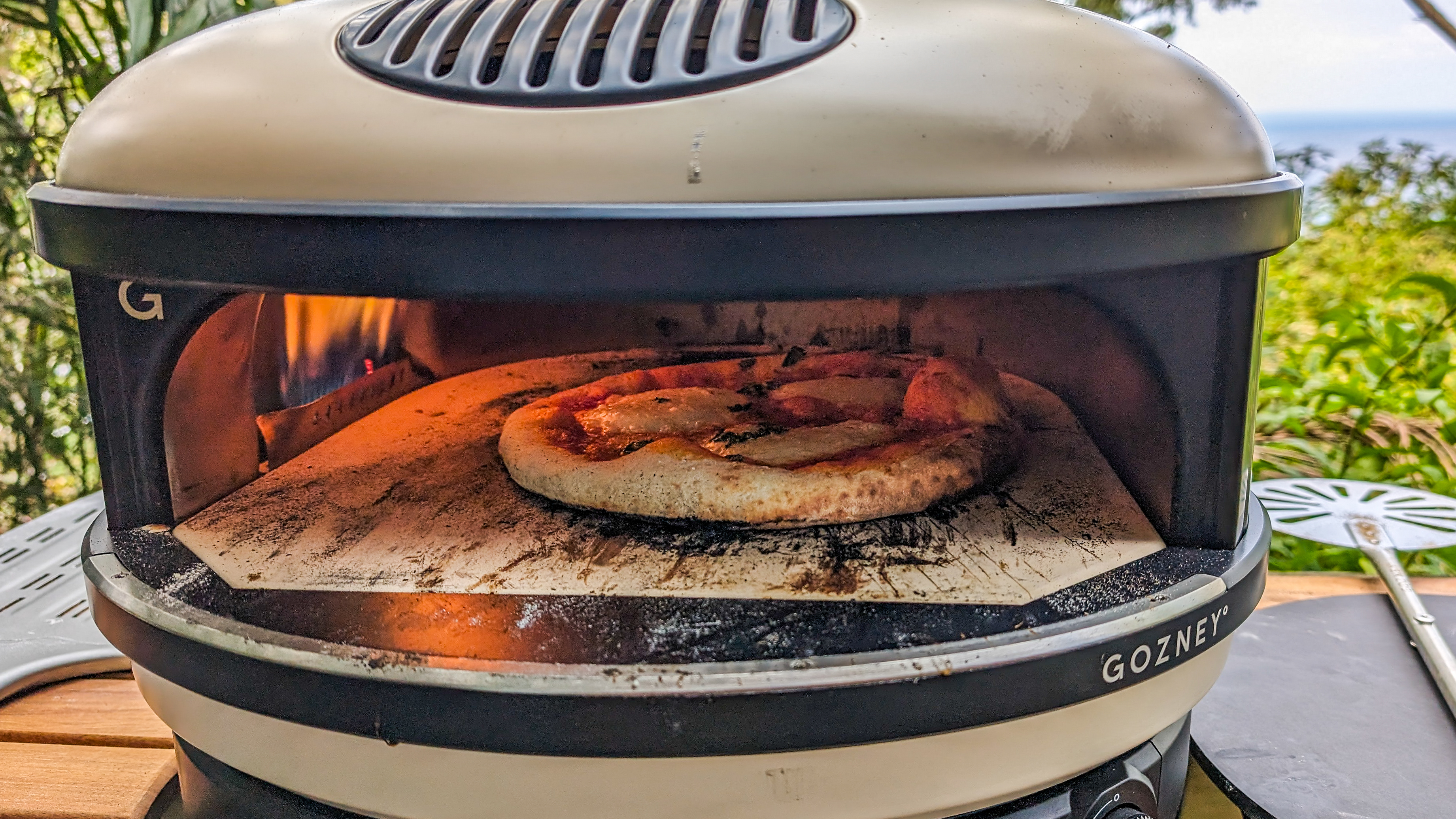 A pizza cooking inside the Gozney Arc XL oven