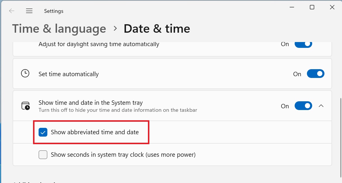 show abbreviated date and time in system tray windows 11 23h2 beta