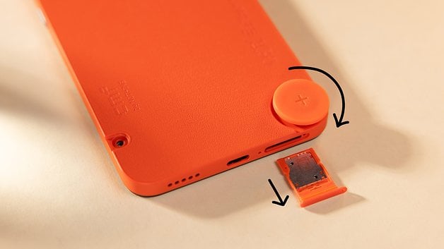 Here's how you unscrew the Accessory Point and remove the SIM tray on the CMF Phone 1.