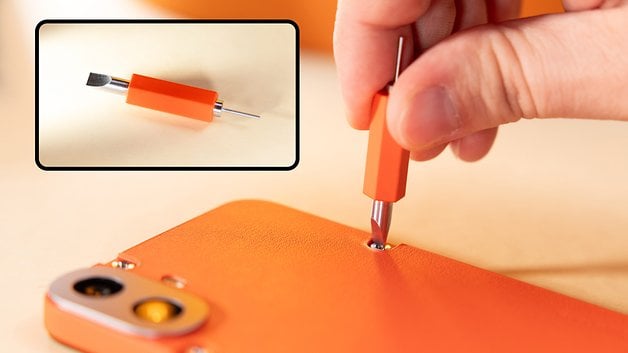 Image depicts the removal of screws from the back cover.