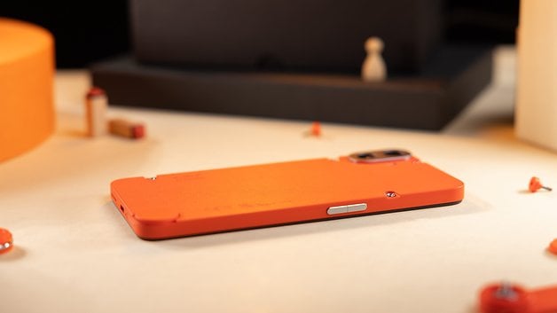 The CMF Phone 1 as seen from the side and placed flat on a table.