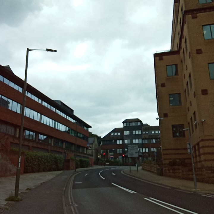 An original photo taken with the Rabbit R1, showing a street.