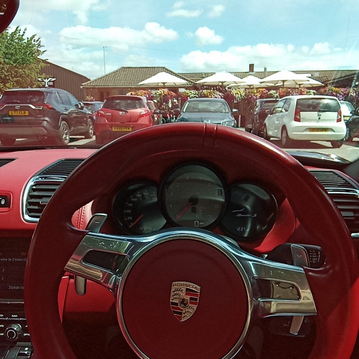 An original photo taken with the Rabbit R1, showing a steering wheel.