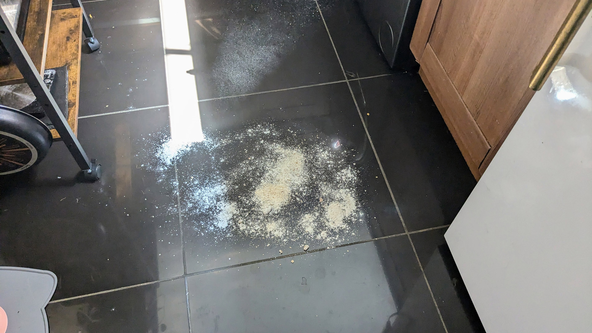 Flour on a kitchen floor to be cleaned by the iRobot Roomba Combo j5+