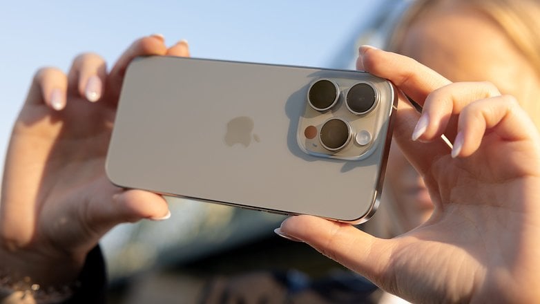 A person holding an iPhone 16 Pro showcasing its camera design.