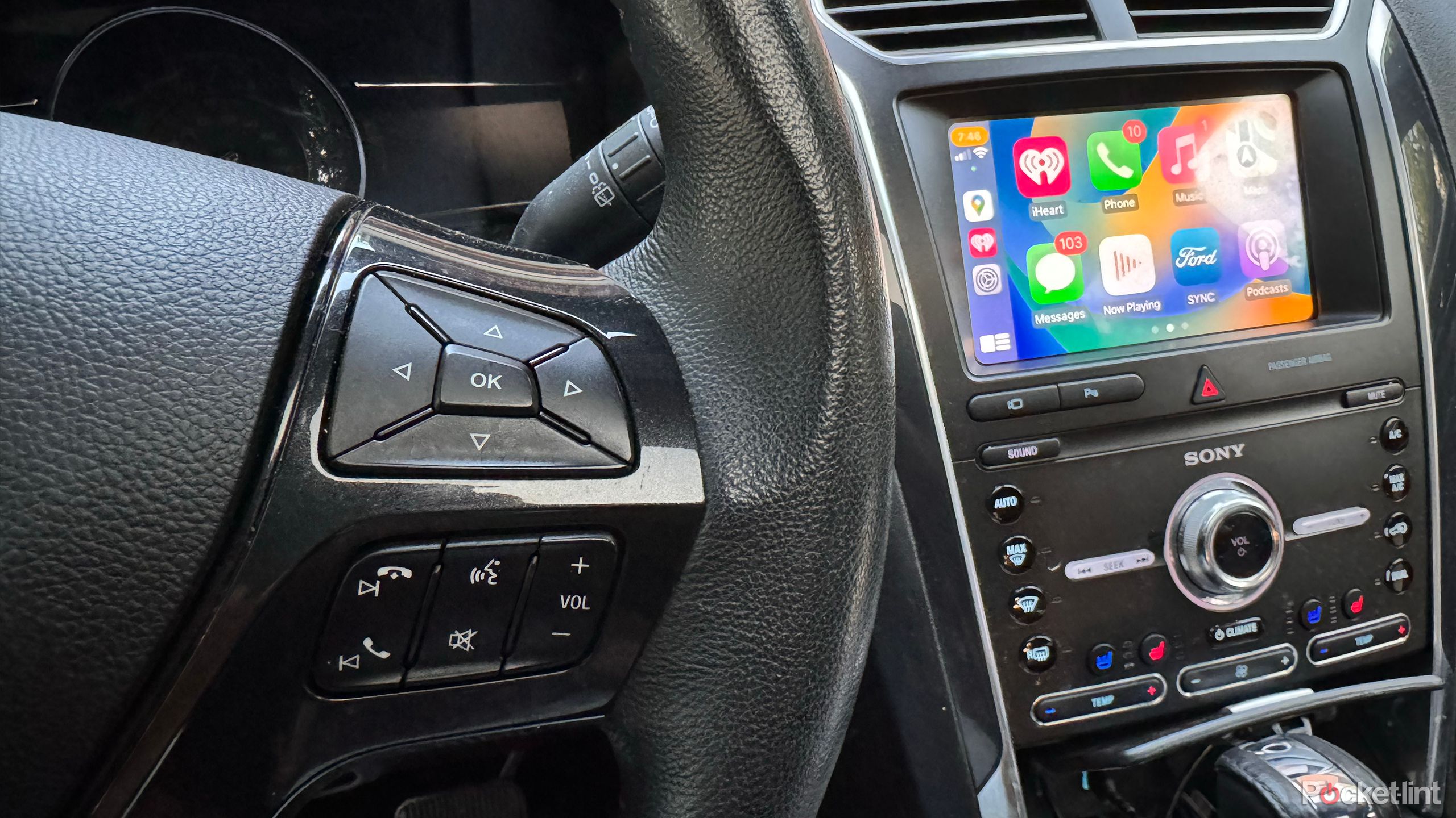 The buttons on a steering wheel can be used to control Siri in CarPlay