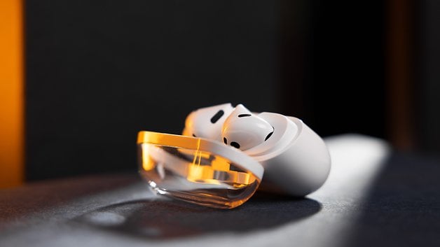 Samsung Galaxy Buds 3 with its charging case, showing off a sleek design in soft light.