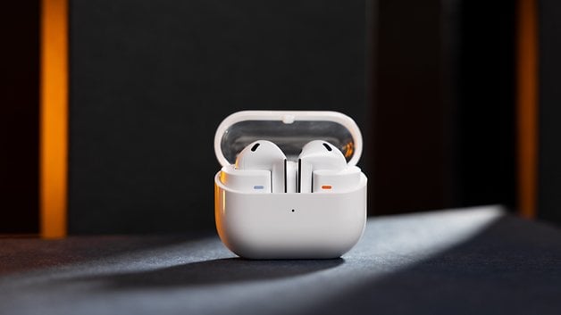 Samsung Galaxy Buds 3 in its charging case on a dark surface.