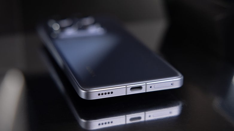 Close-up of a Xiaomi 14T Pro smartphone showing its sleek design and charging port.