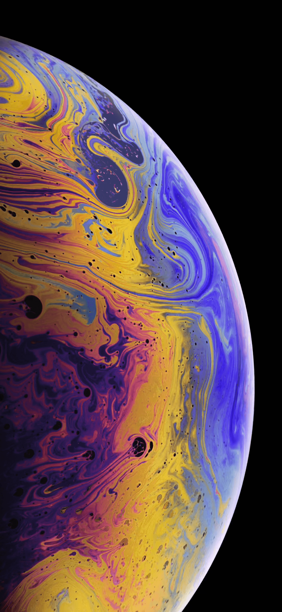 The iPhone XS Bubble Planet wallpaper.