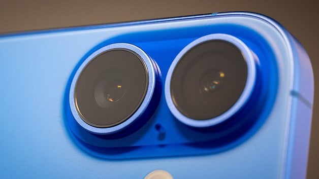 Close-up of the dual camera lenses of an Ultramarine Apple iPhone 16.