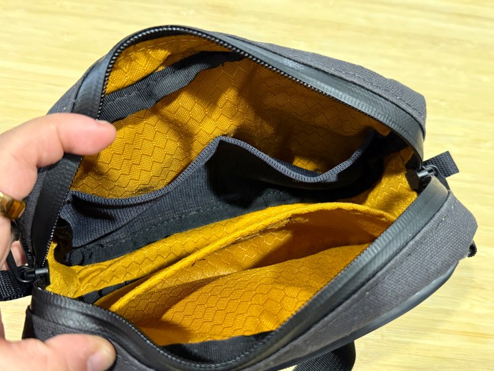 Waterfield Designs Shinjuku Sling in black, showing what it looks like inside when empty.