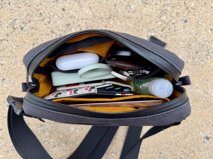 Waterfield Designs Shinjuku Sling in black, showing what it looks like inside when full.