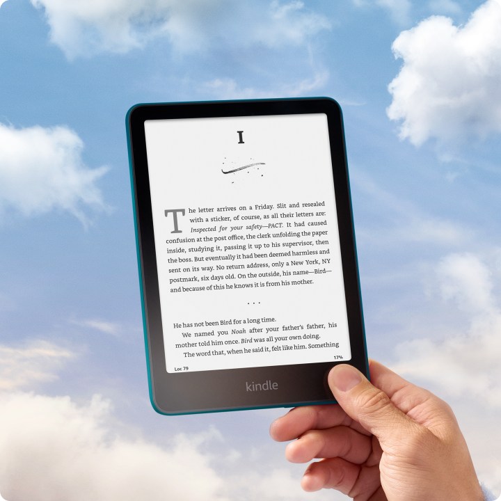 Amazon Kindle Paperwhite 2024 12th-generation with an eBook on the app and sky in the background