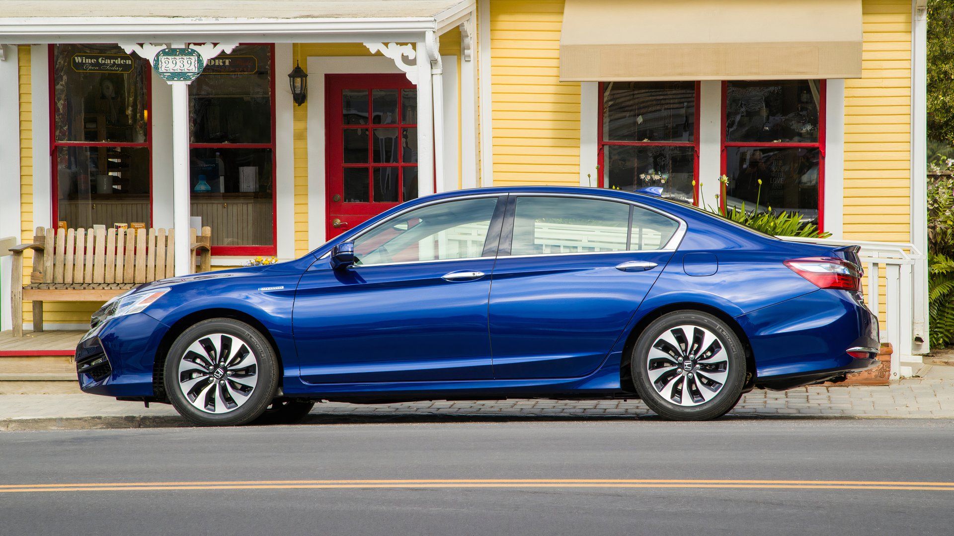 Side profile shot of a blue 2017 Honda Accord Hybrid 