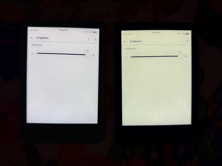 Matcha Kindle (2024) (left) and a black Kindle (2022) showing brightness difference.