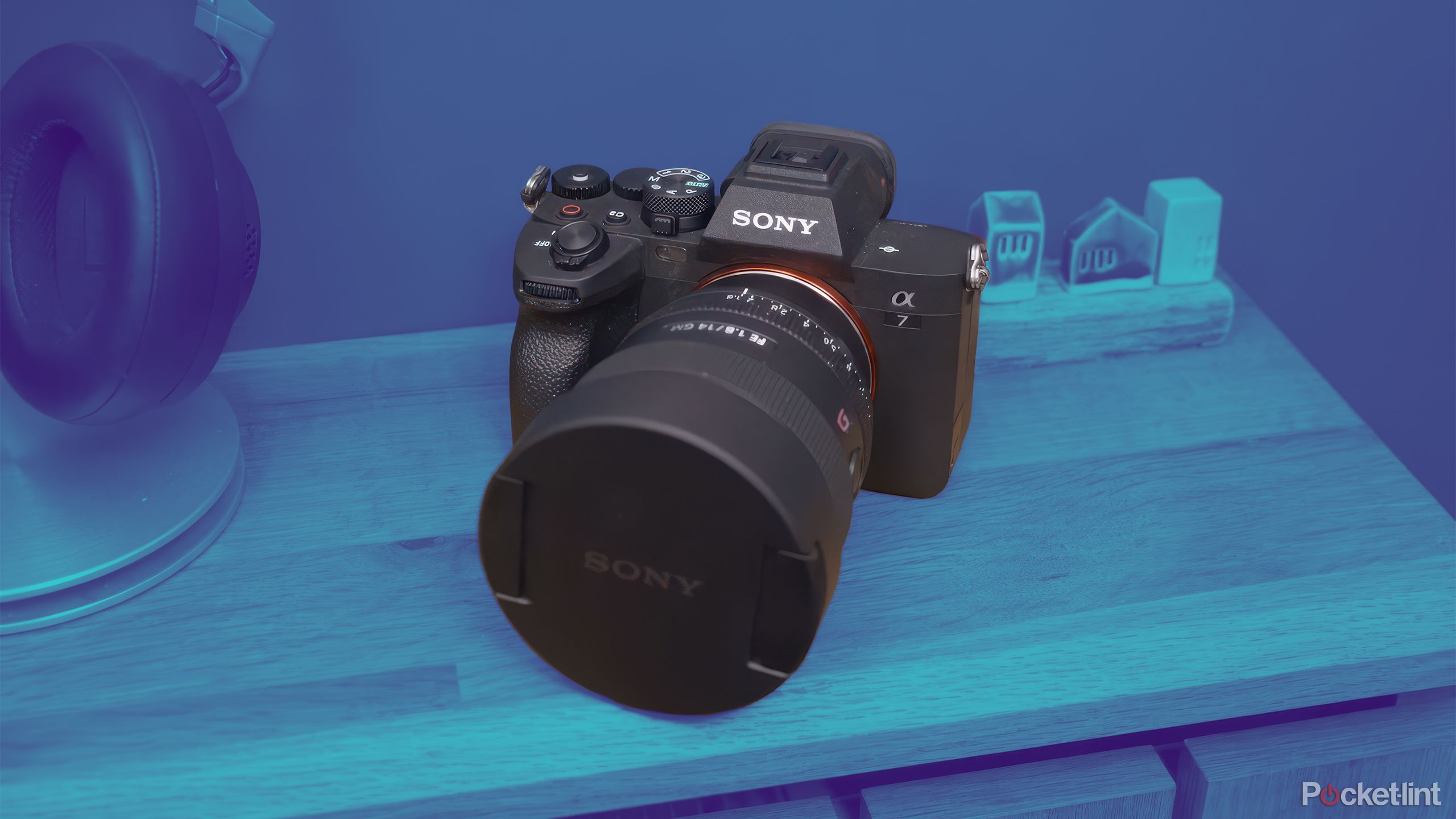 The Sony A7 IV sits on a table with the entire scene in a blue gradient. 