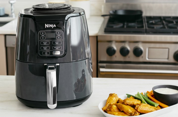 The Ninja 4-quart air fryer on a kitchen counter.