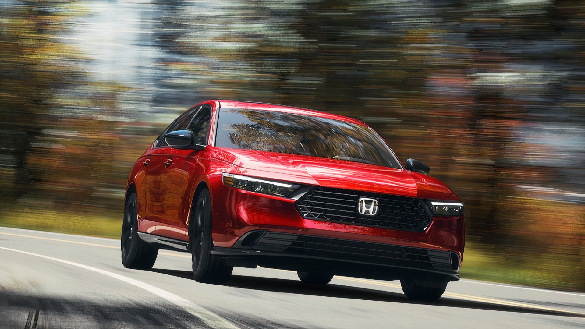 A red 2024 Honda Accord Hybrid midsize hybrid car. 