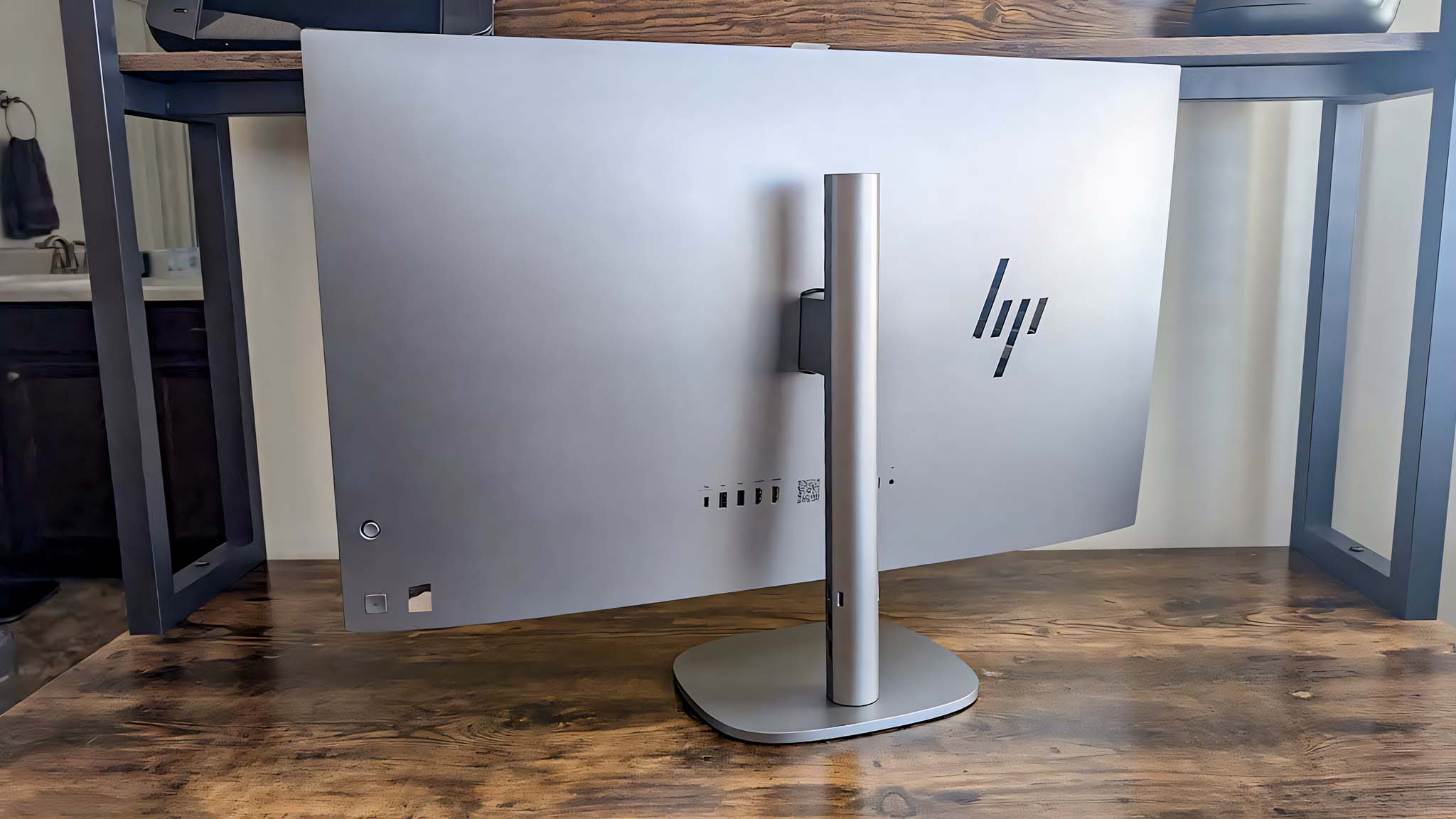 HP OmniStudio X on a desk with the backside facing the camera.