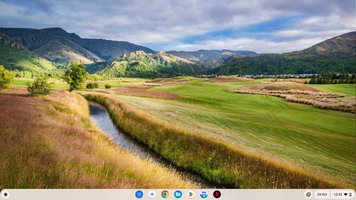 ChromeOS desktop with green hills wallpaper and no icons or clutter screenshot